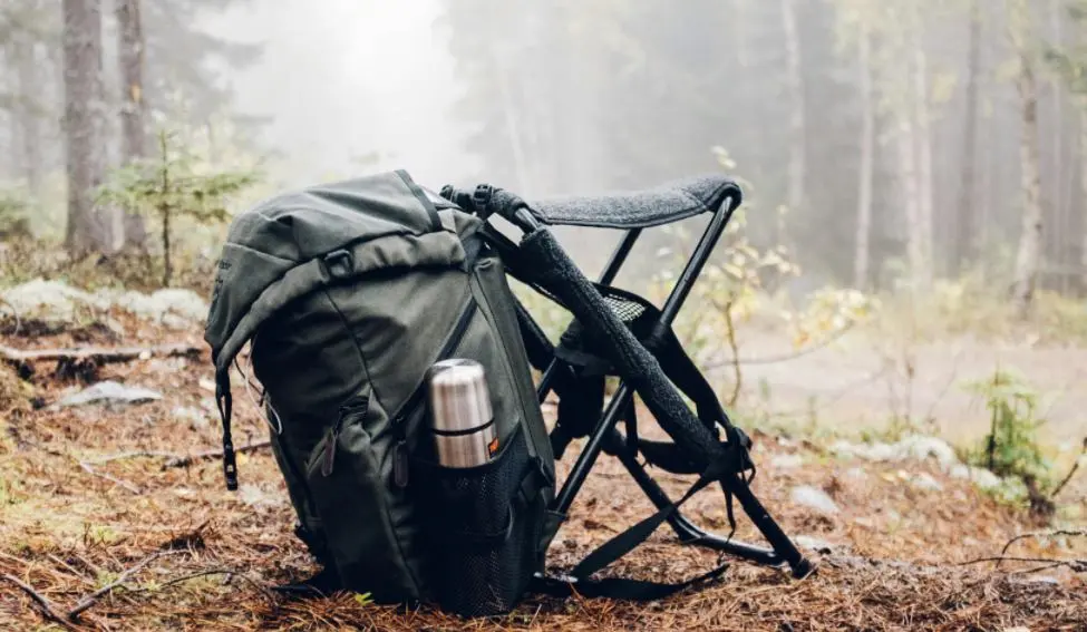 a a backpack and a chair ready for turkey hunting